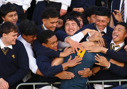 Students celebrating a rugby win