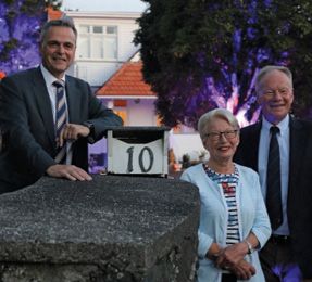 Tim O'Connor, Norma Willis and Grant Trethewey at the gate of 10 Clive Road